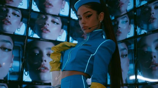 A wall of screens with her face